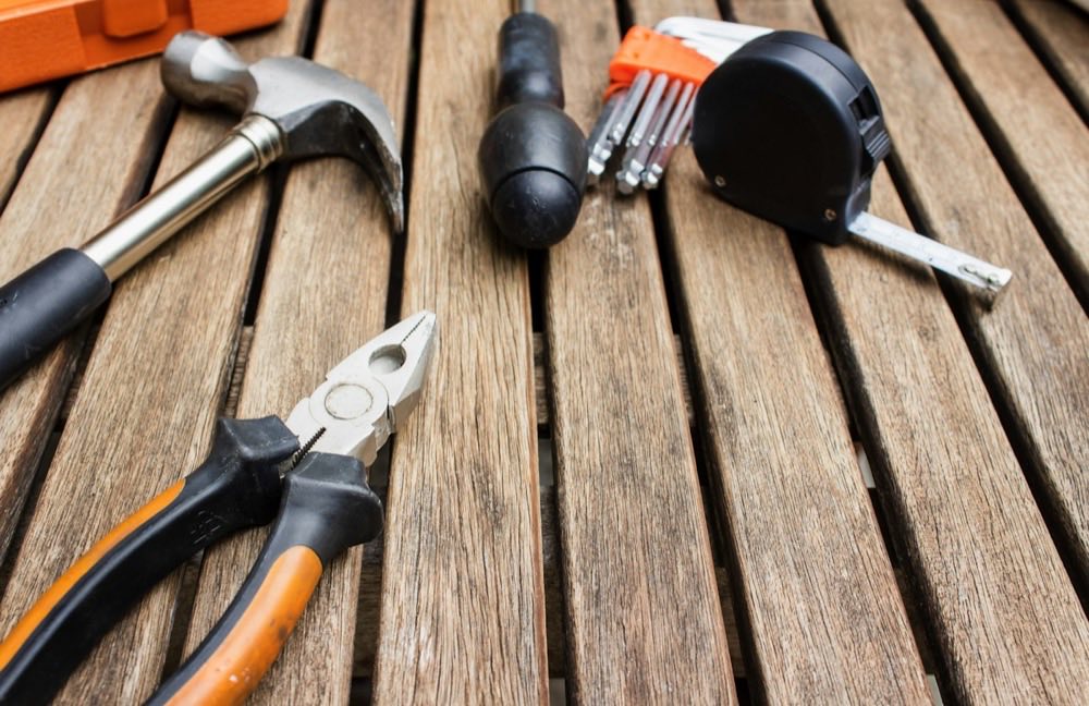 Hand tools laid out on a workbench