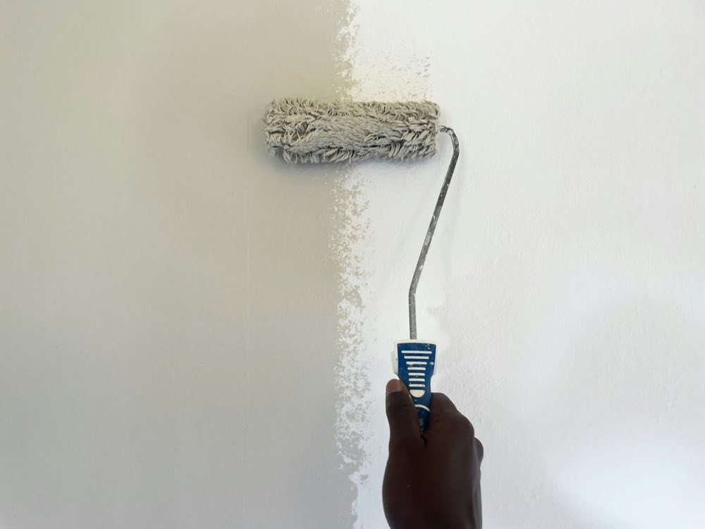 A paint roller on a wall